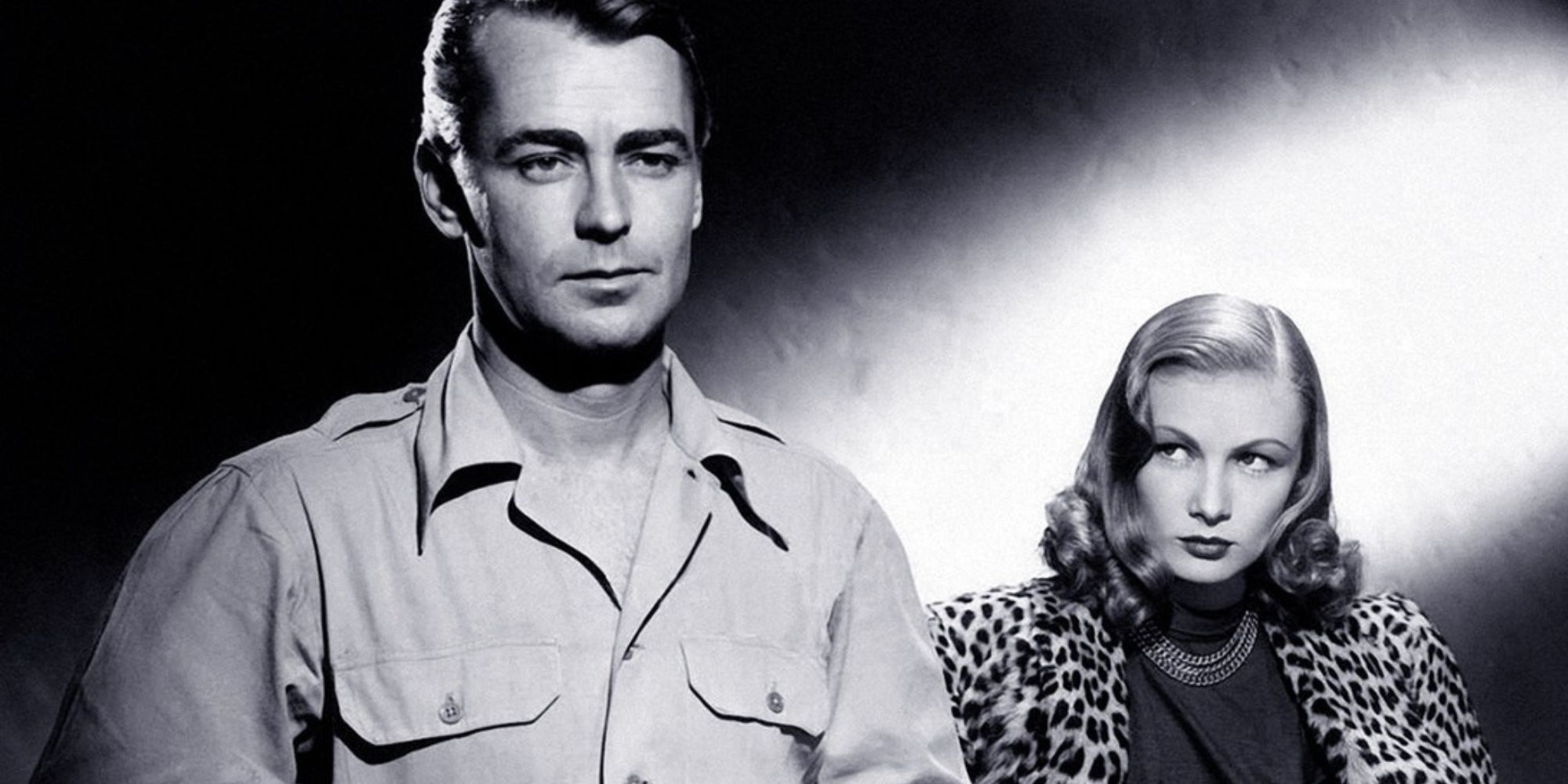 Veronica Lake looking at Alan Ladd, who's looking firmly ahead, in Saigon