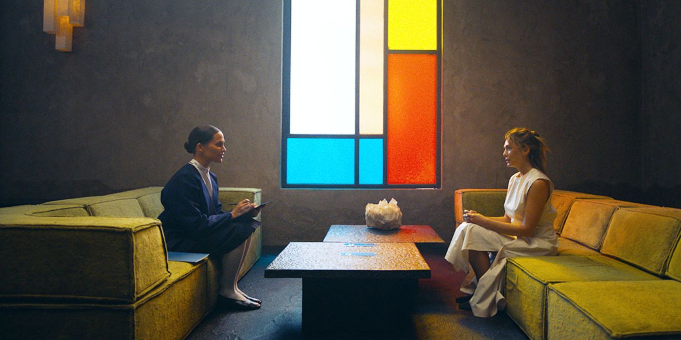 Alicia Vikander sitting across from Elizabeth Olsen in a scene from 'The Assessment'.