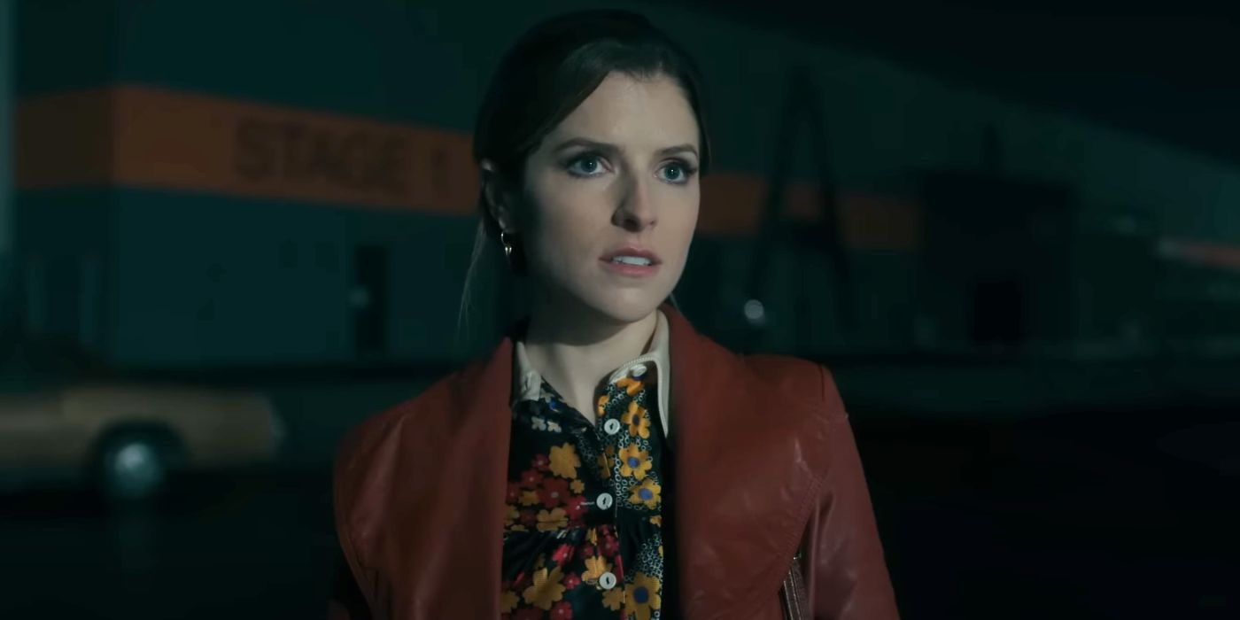 Anna Kendrick looking nervous while standing in a parking lot at night in Woman of the Hour.