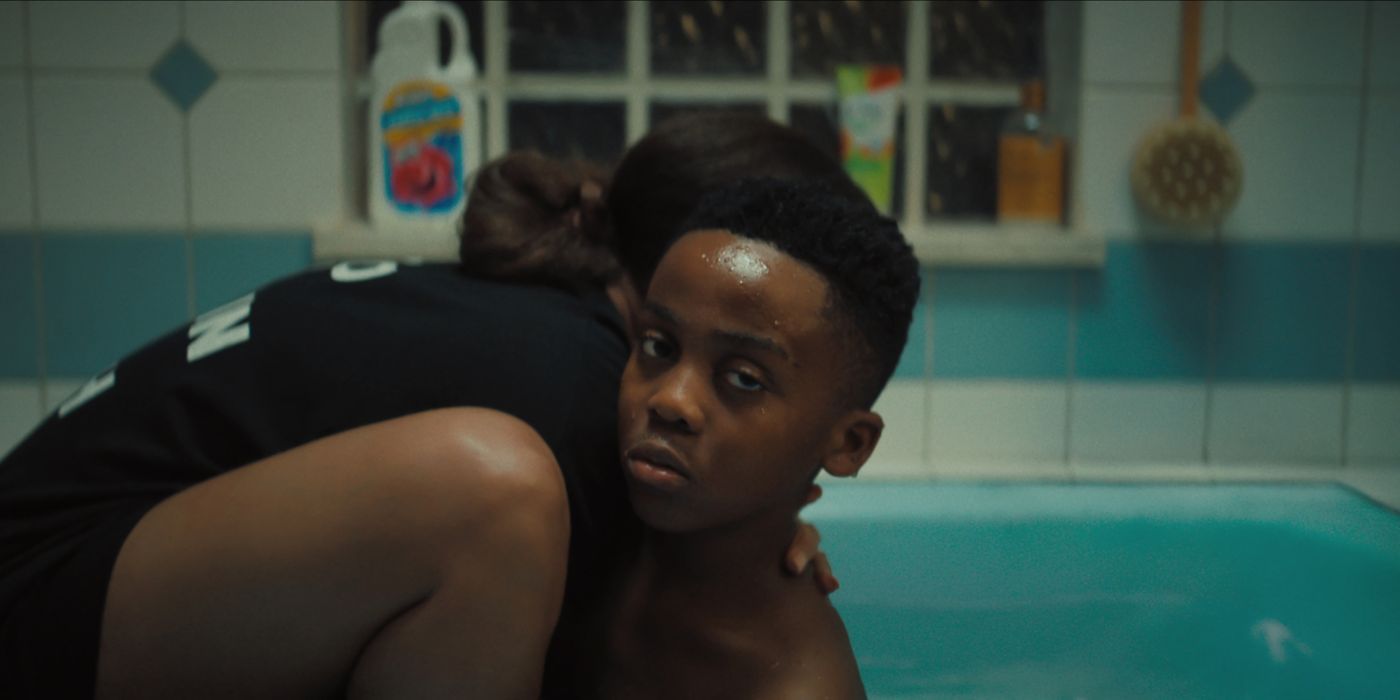 Dre (Anthony B. Jenkins) being hugged by Ebony (Andra Day) in the bathtub in 'The Deliverance.'