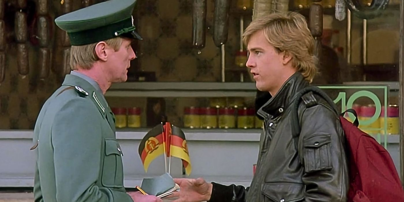 Anthony Edwards faces a German officer in uniform as they exchange documents in the 80s movie Gotcha!