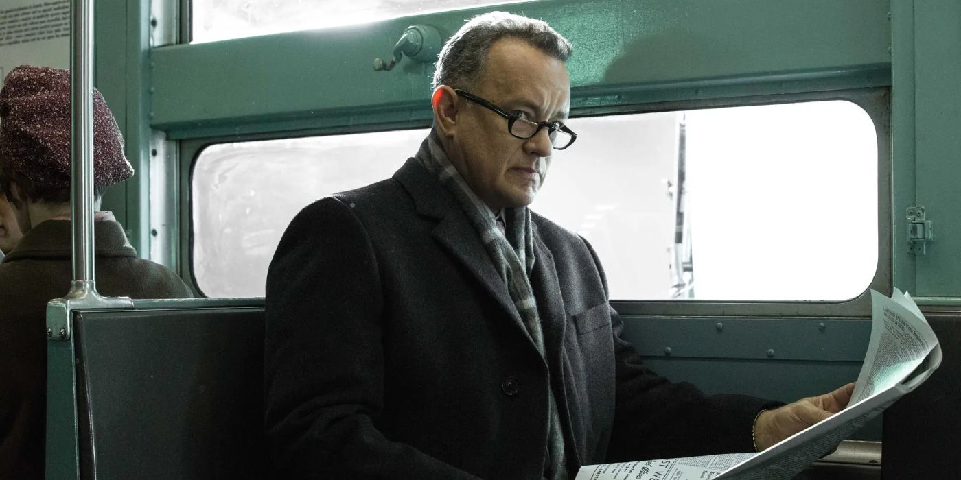 In Bridge of Spies (2015), James B. Donovan (Tom Hanks) is sitting on a train reading a newspaper.