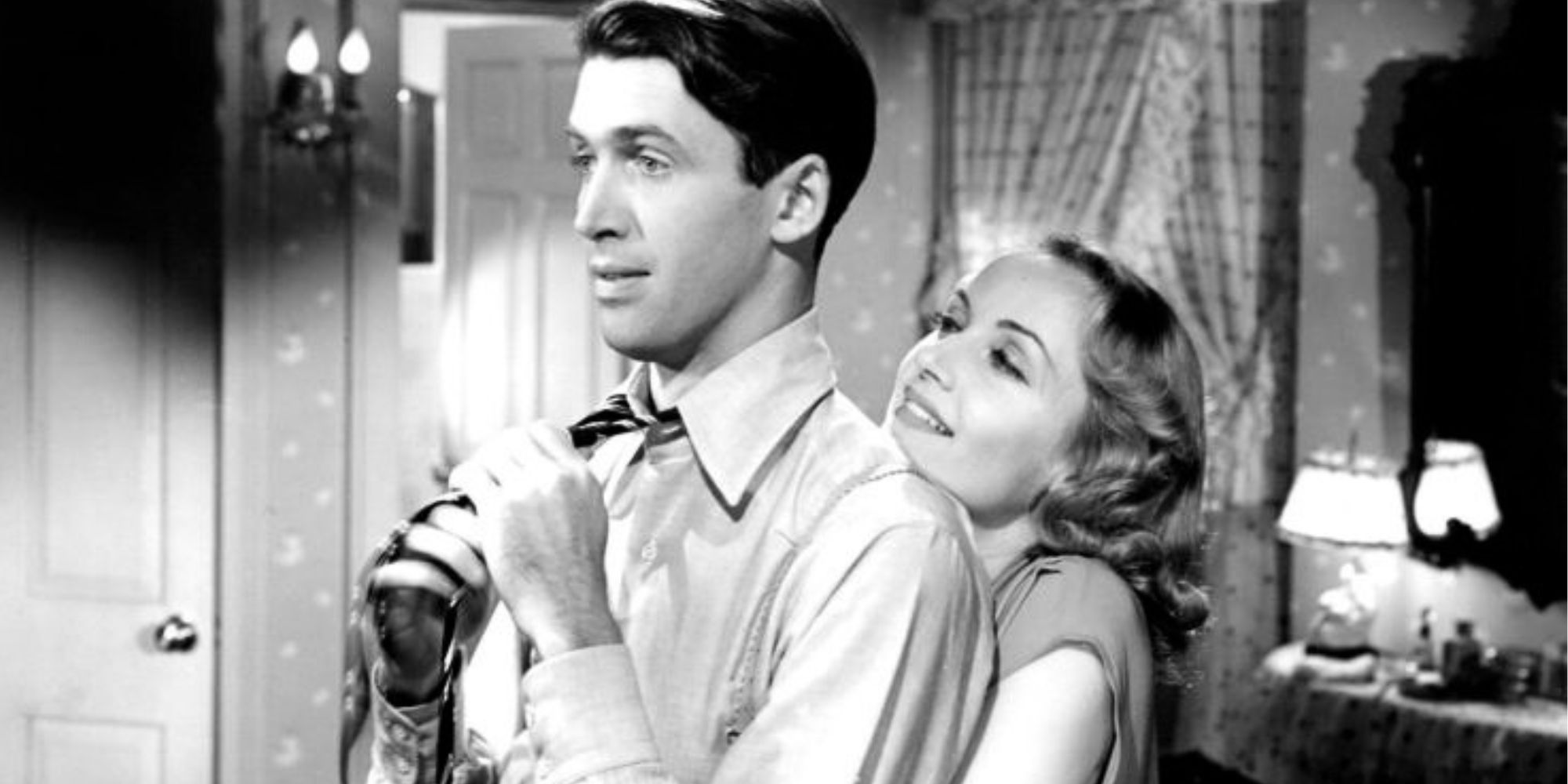 Carole Lombard hugging James Stewart from behind in Made for Each Other (1939)