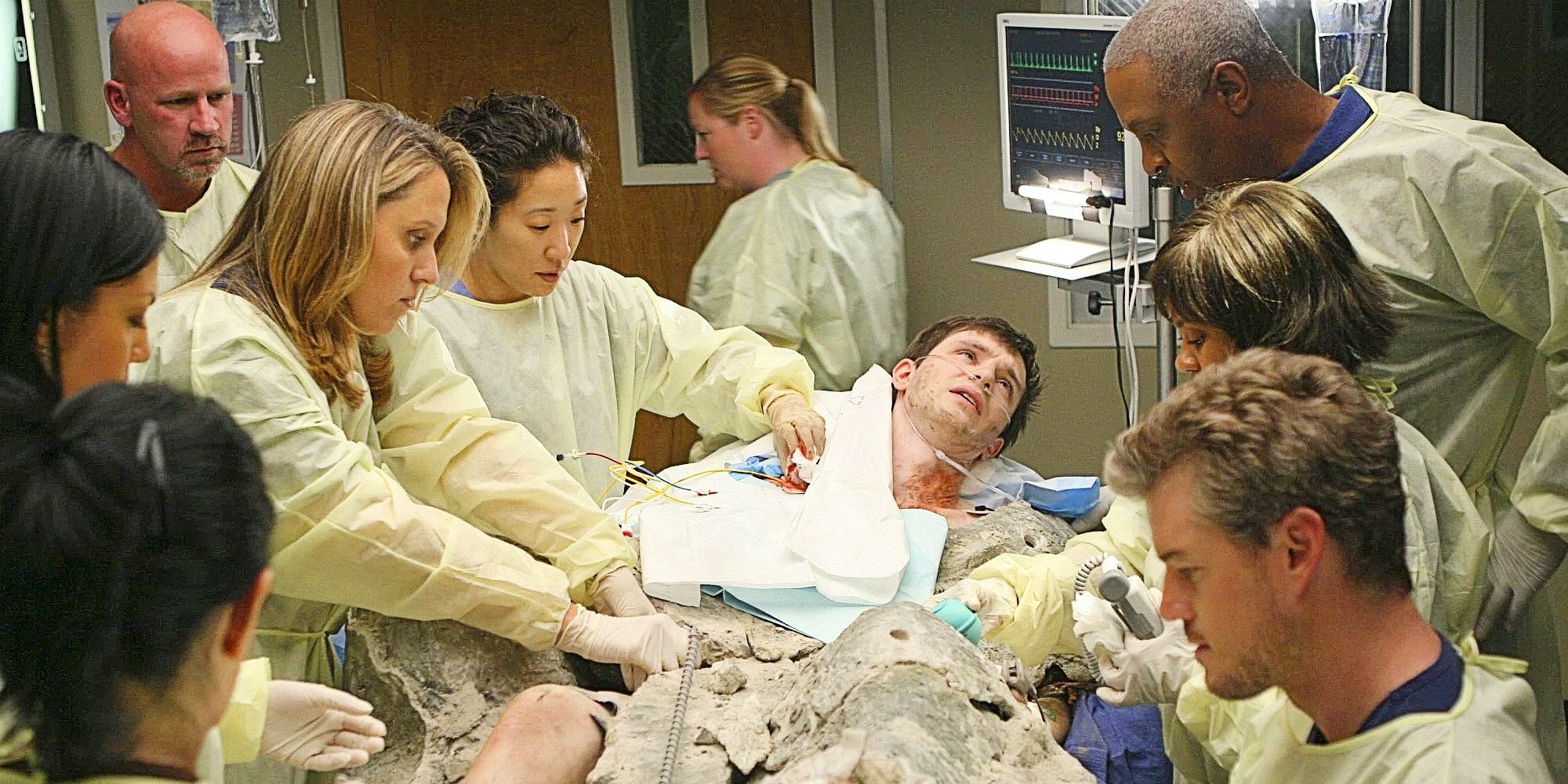 Erika Hahn, Cristina Yang, Richard Webber, Miranda Bailey, and Mark Sloan with a patient in Grey's Anatomy