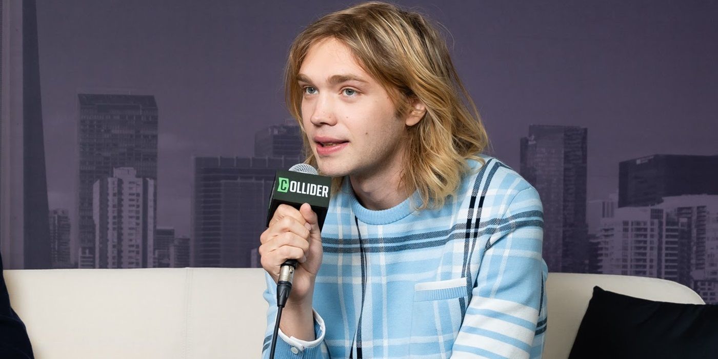 Charlie Plummer speaking into a microphone at the Collider interview studio at TIFF 2024