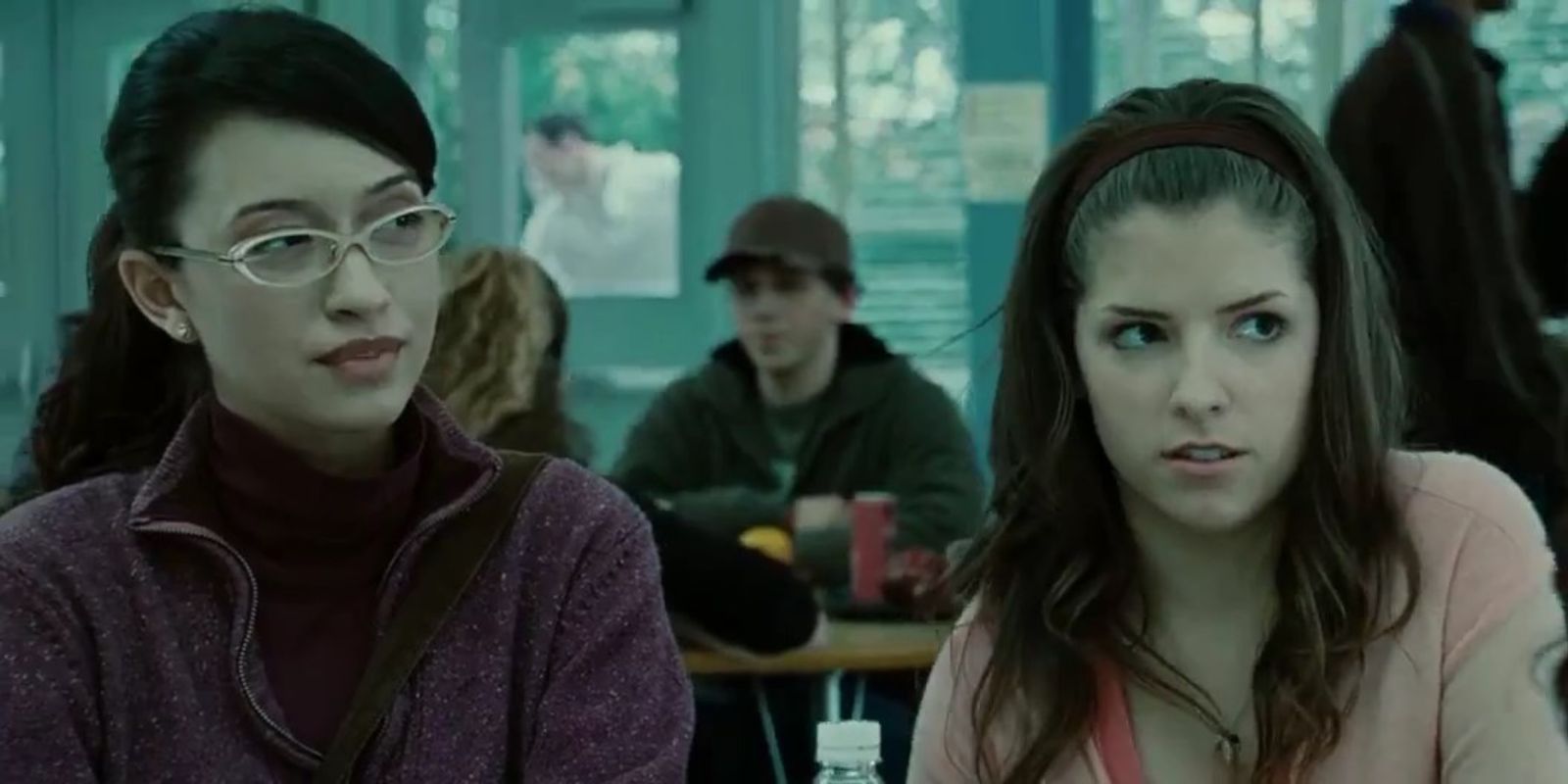 Angela and Jessica looking in the same direction at the cafeteria in Twilight