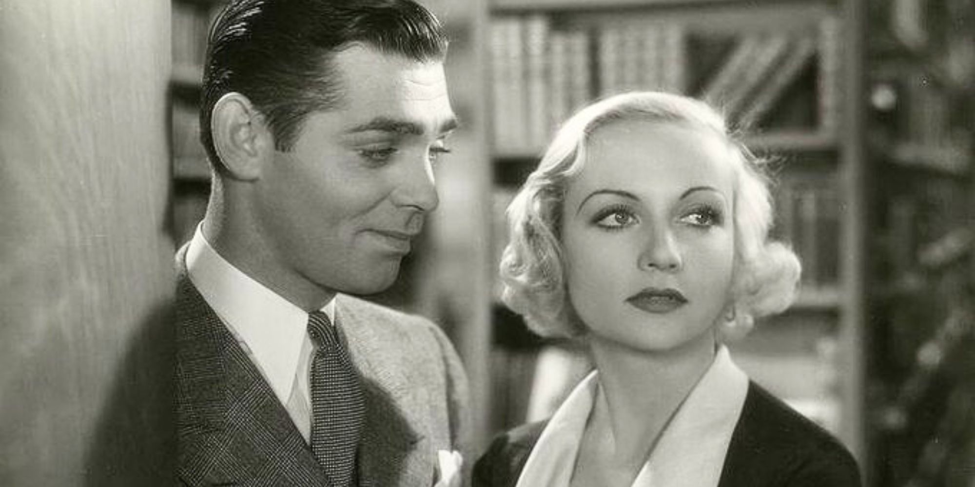 Clark Gable looking at Carole Lombard standing next to him in No Man of Her Own (1932)
