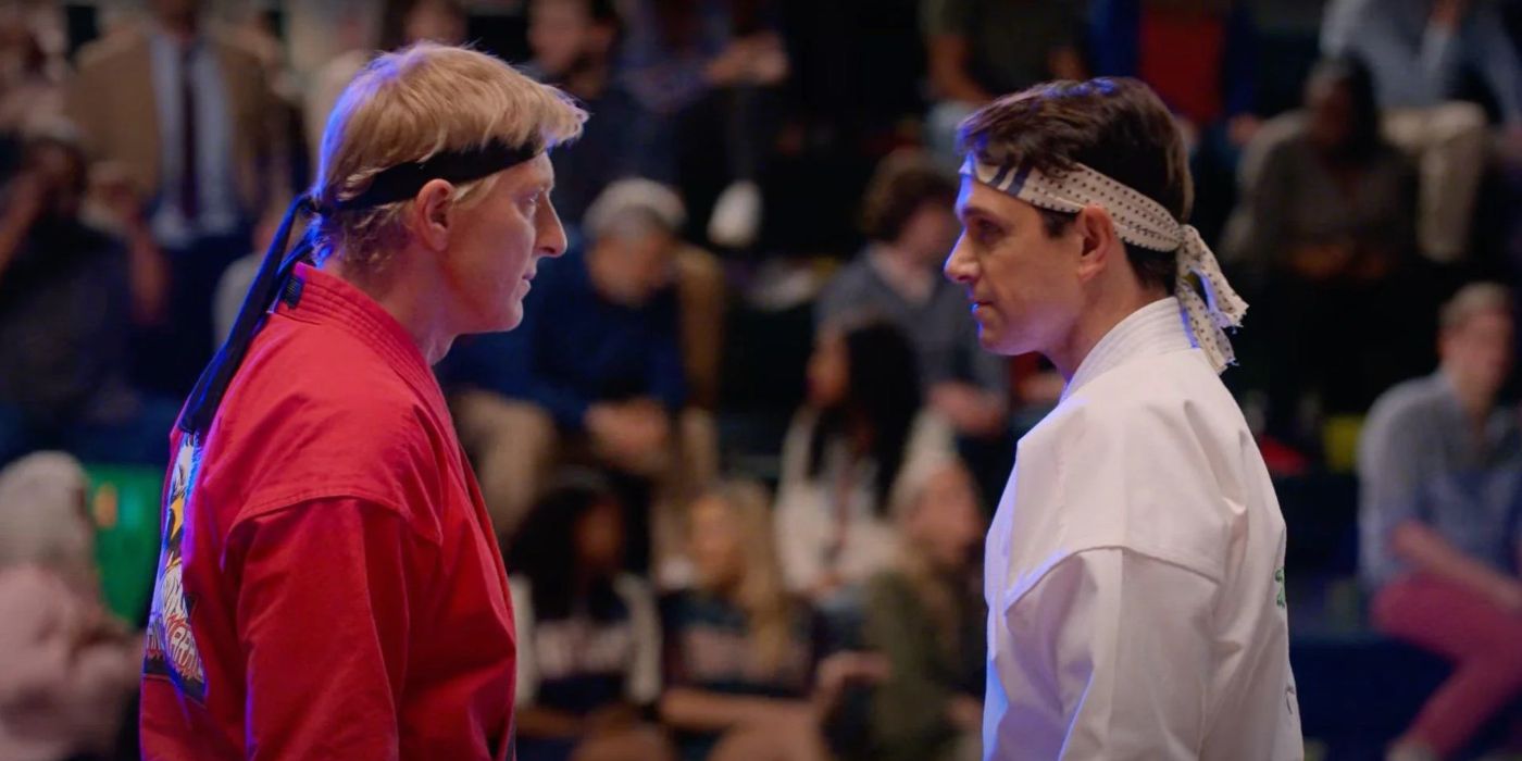 Johnny Lawrence (William Zabka) staring at Daniel LaRusso (Ralph Macchio) in a tournament in Cobra Kai.