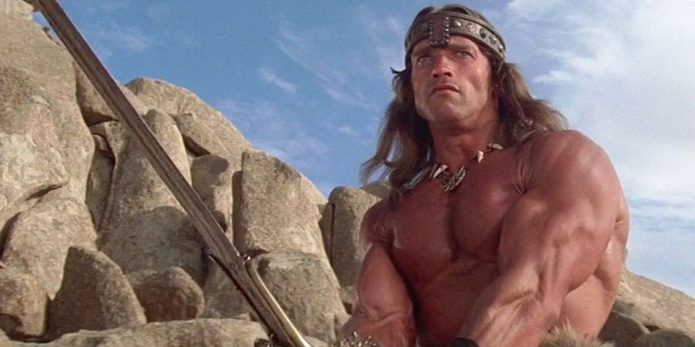 Arnold Schwarzenegger in Conan the Barbarian wielding a sword and shirtless