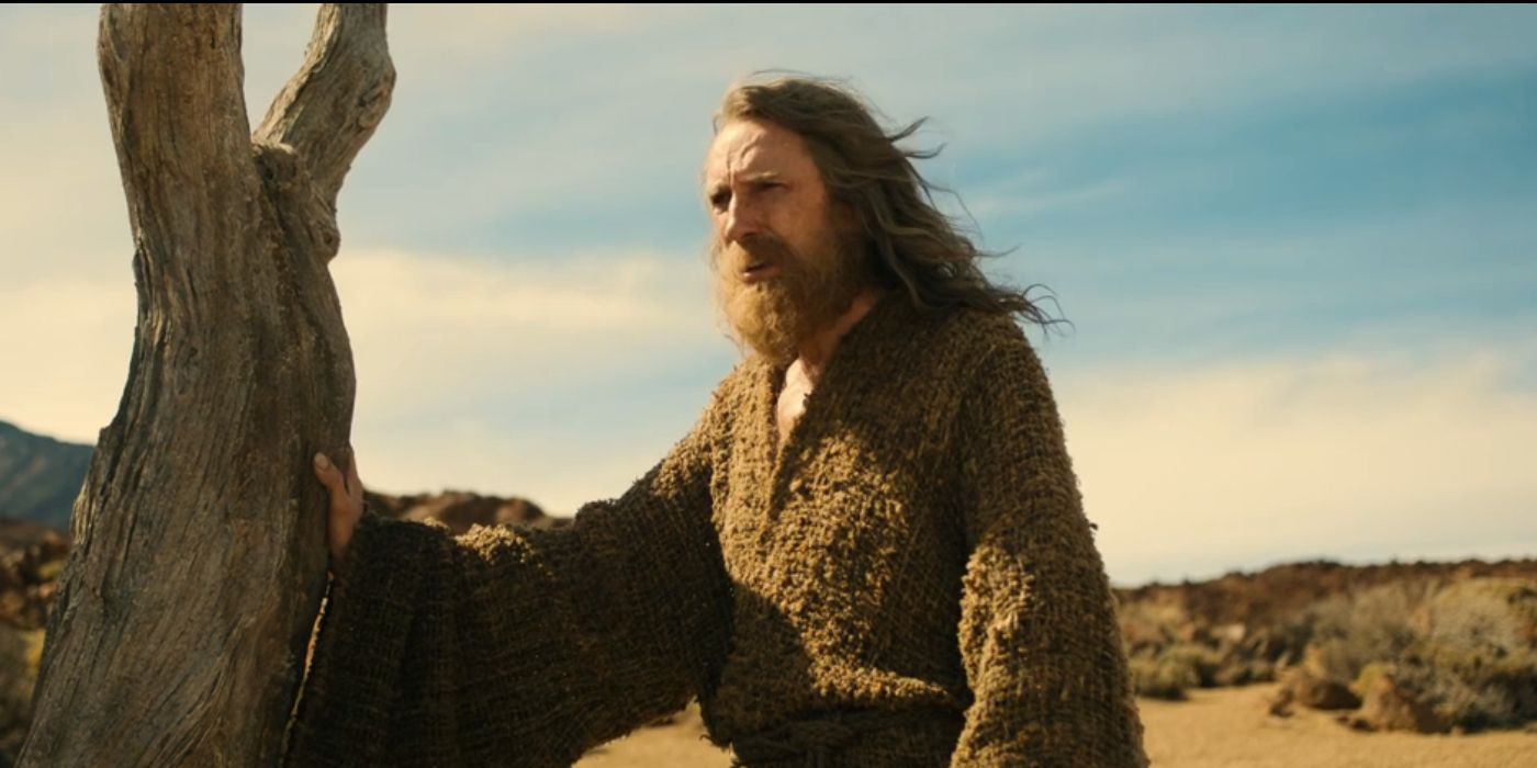 Daniel Weyman as the Stranger standing beside a tree in &lsquo;The Rings of Power&rsquo; Season 2, Episode 1.