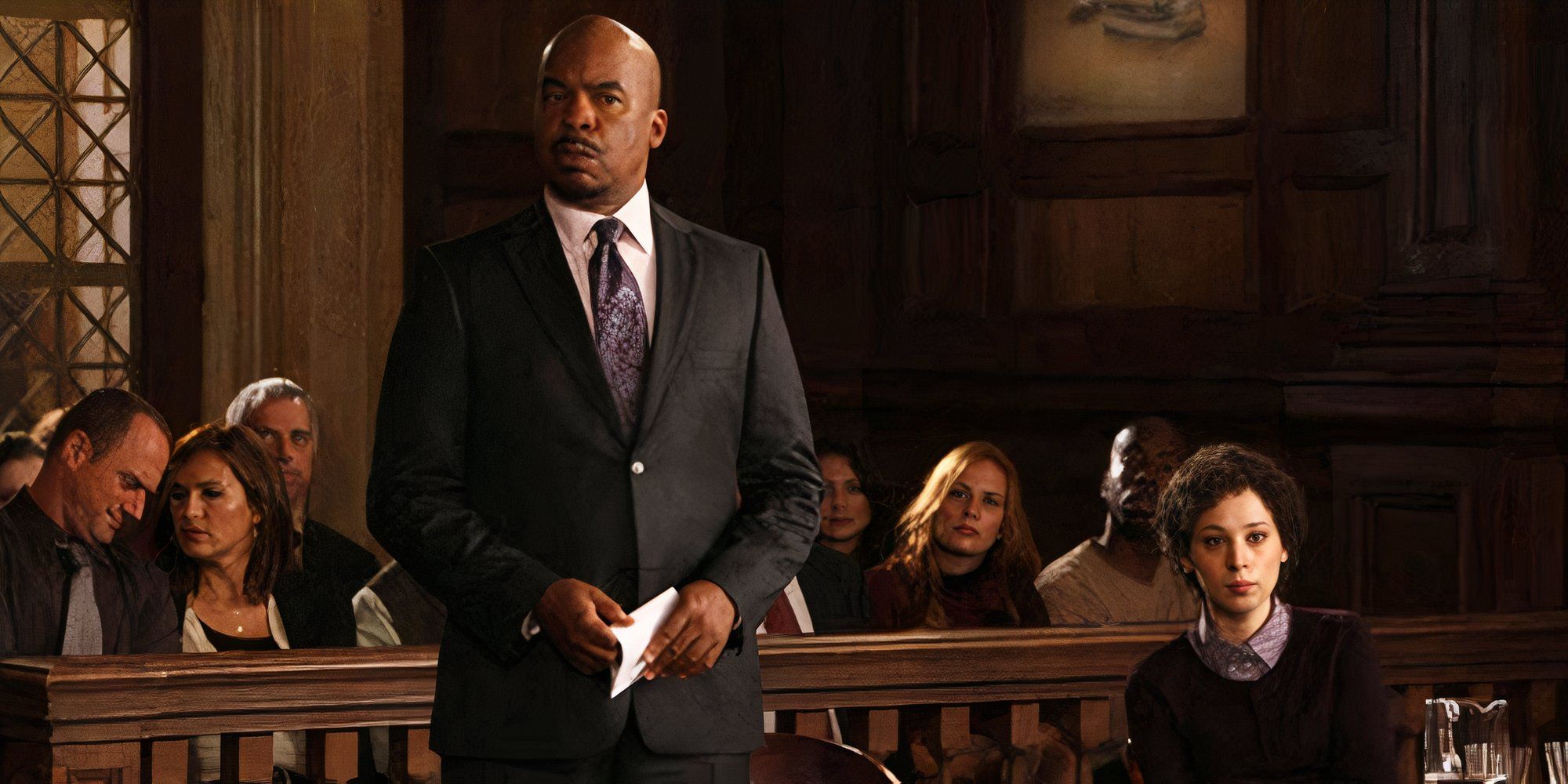 David Alan Grier standing up at the defense table next to Bess Rous who is sitting down in Law & Order SVU