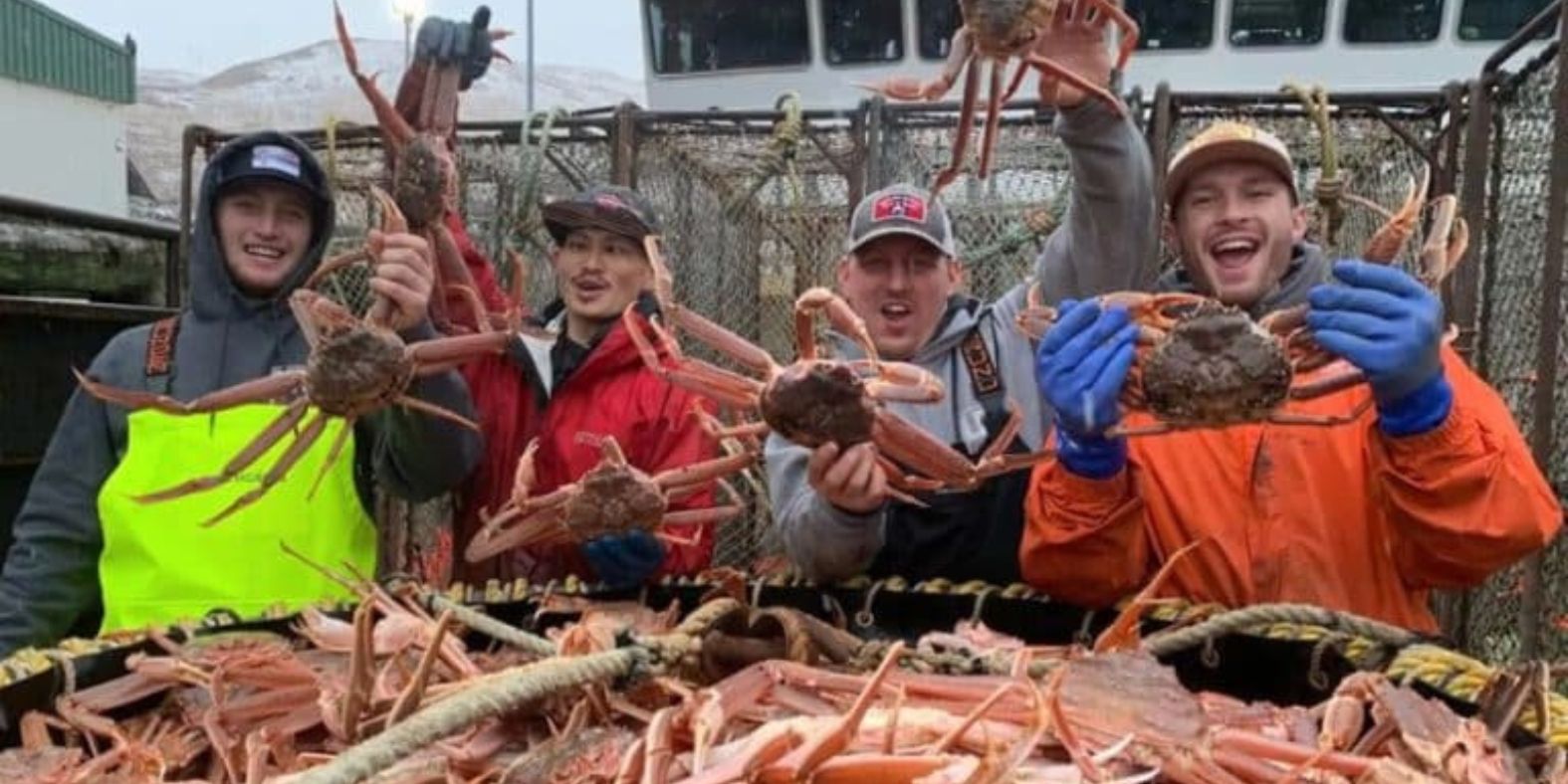 'Deadliest Catch' deckhands showing off the crabs they caught. 