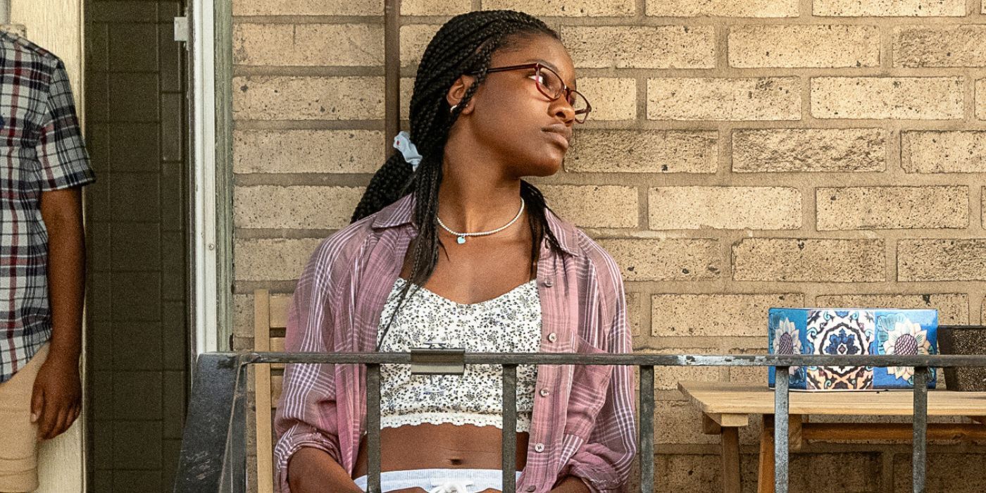 Demi Singleton sits on a patio as Shante in 'The Deliverance.'