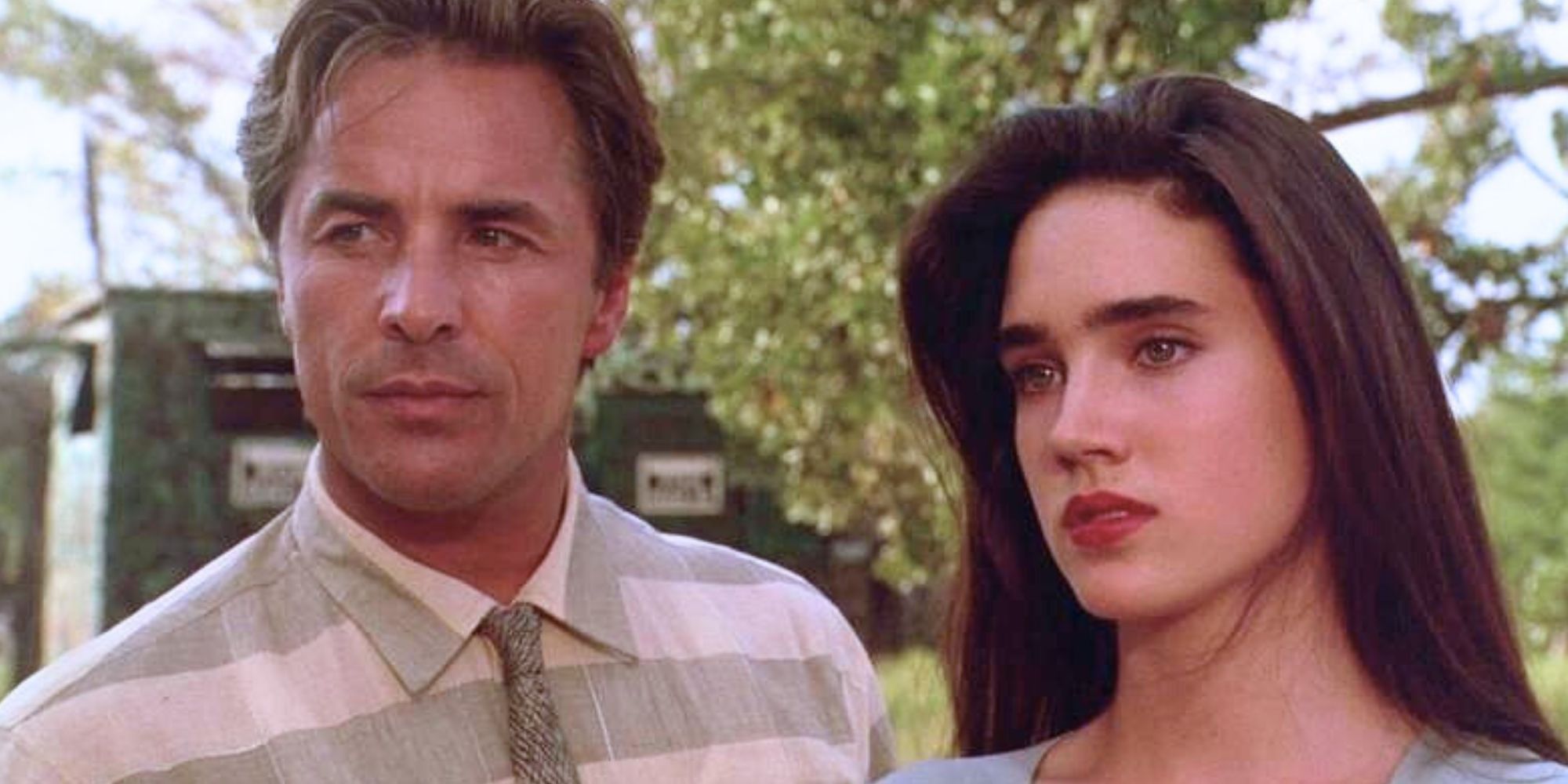 Don Johnson standing next to Jennifer Connelly in The Hot Spot (1990).