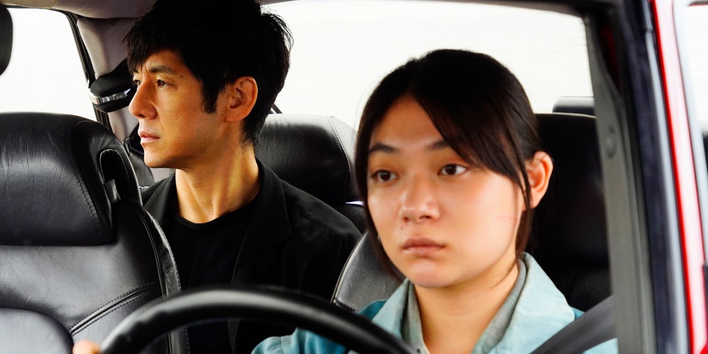 Hidetoshi Nishijima as Yūsuke Kafuku and Tōko Miura as Misaki Watari riding in the car together in Drive My Car