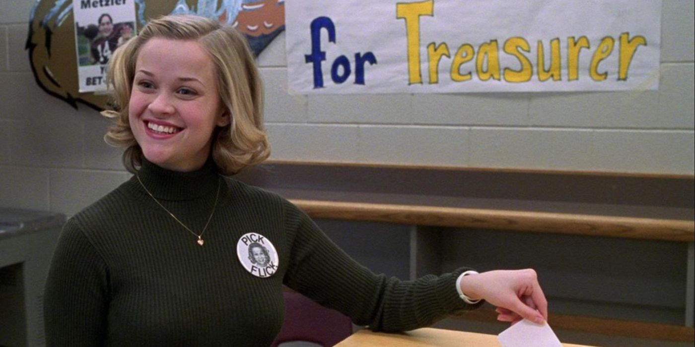 A high school student sports a wide grin as she places a ballot in the box for her school election in 'Election' (1999).