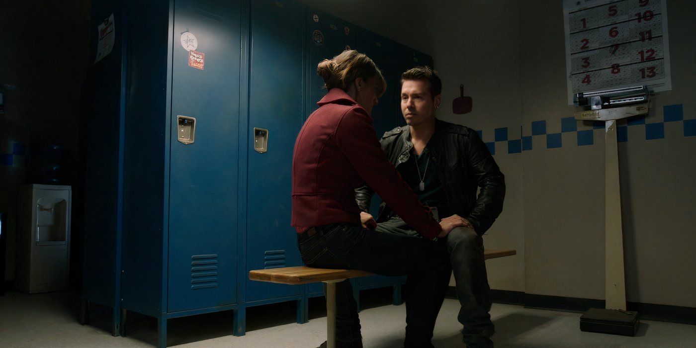 America Olivo as Laura Dawson and Jon Seda as Antonio Dawson sit together in the locker room in Chicago P.D.