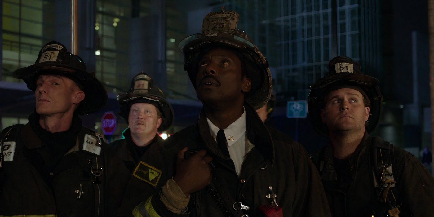 Eamonn Walker as Chief Wallace Boden standing outside on a call among other firefighters in Chicago Fire.