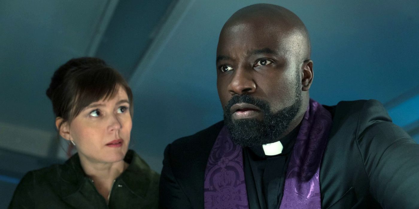 Katja Herbers as Kristen looking to the left at Mike Colter in his priest attire in Season 4 of Evil