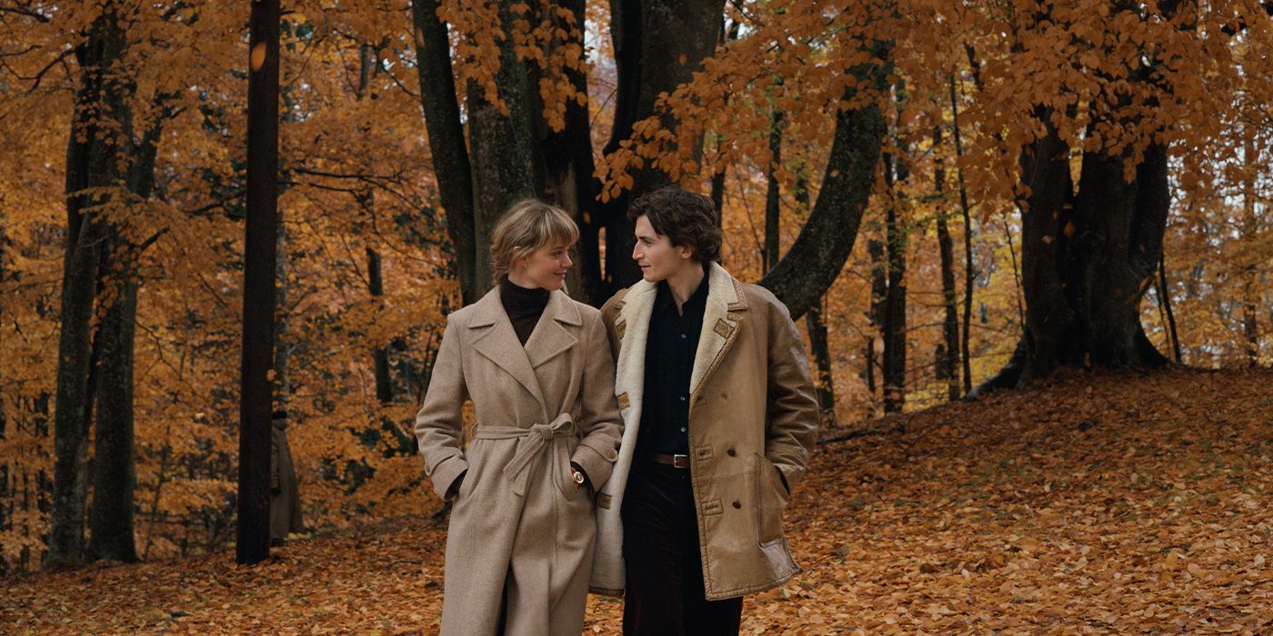 Frida Gustavsson and August Wittgenstein walking together outside around trees