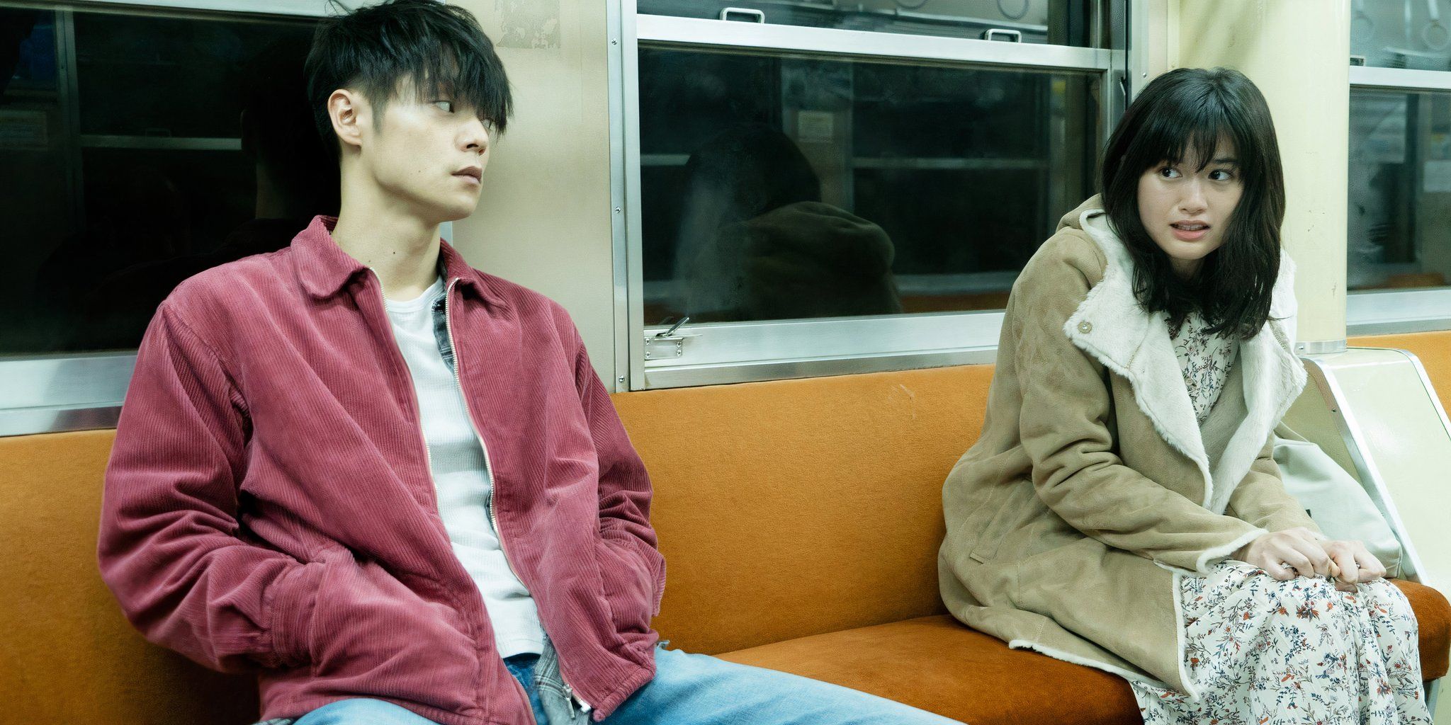Masataka Kubota as Leo Katsuragi and Sakurako Konishi as Yuri/Monica on a train in First Love