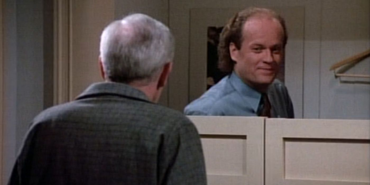Frasier is standing behind a changing room door. The door only goes up to his shoulder, so he is able to see other people in the store. He is talking with his Dad.