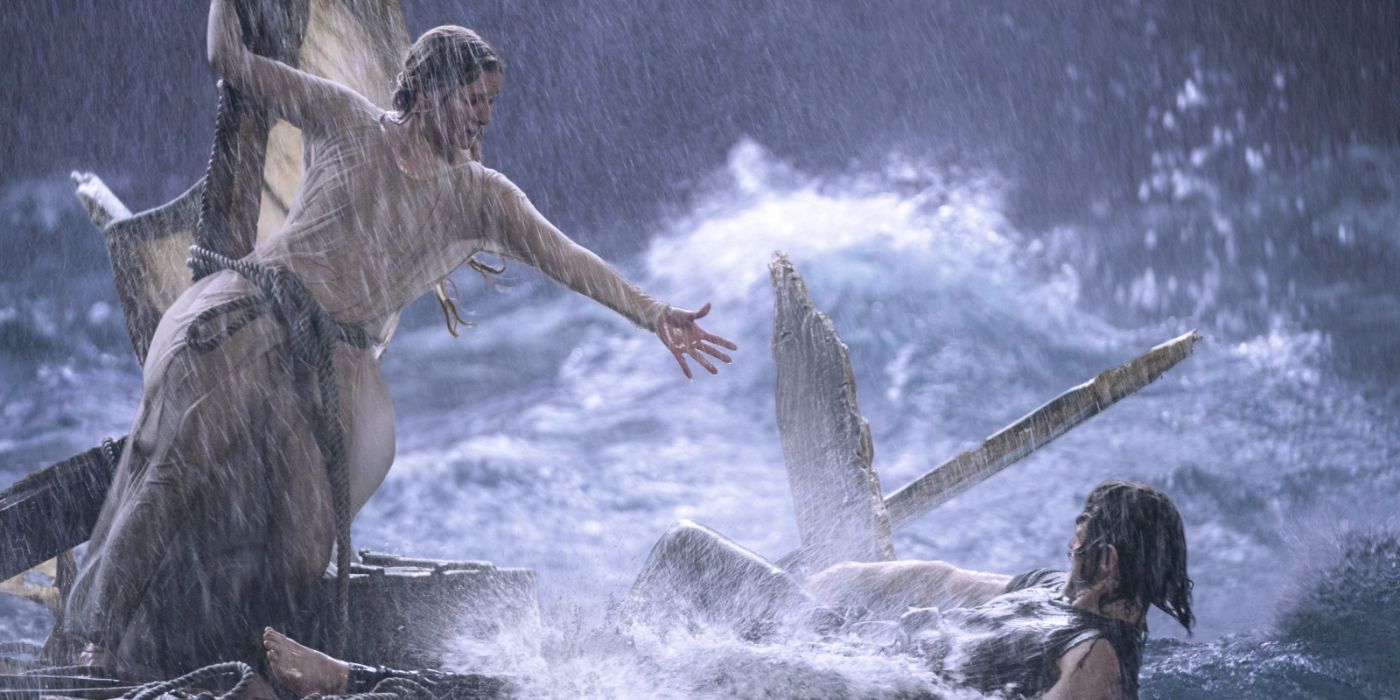 Galadriel and Halbrand in a storm at sea and shipwreck in The Lord of the Rings: Rings of Power.