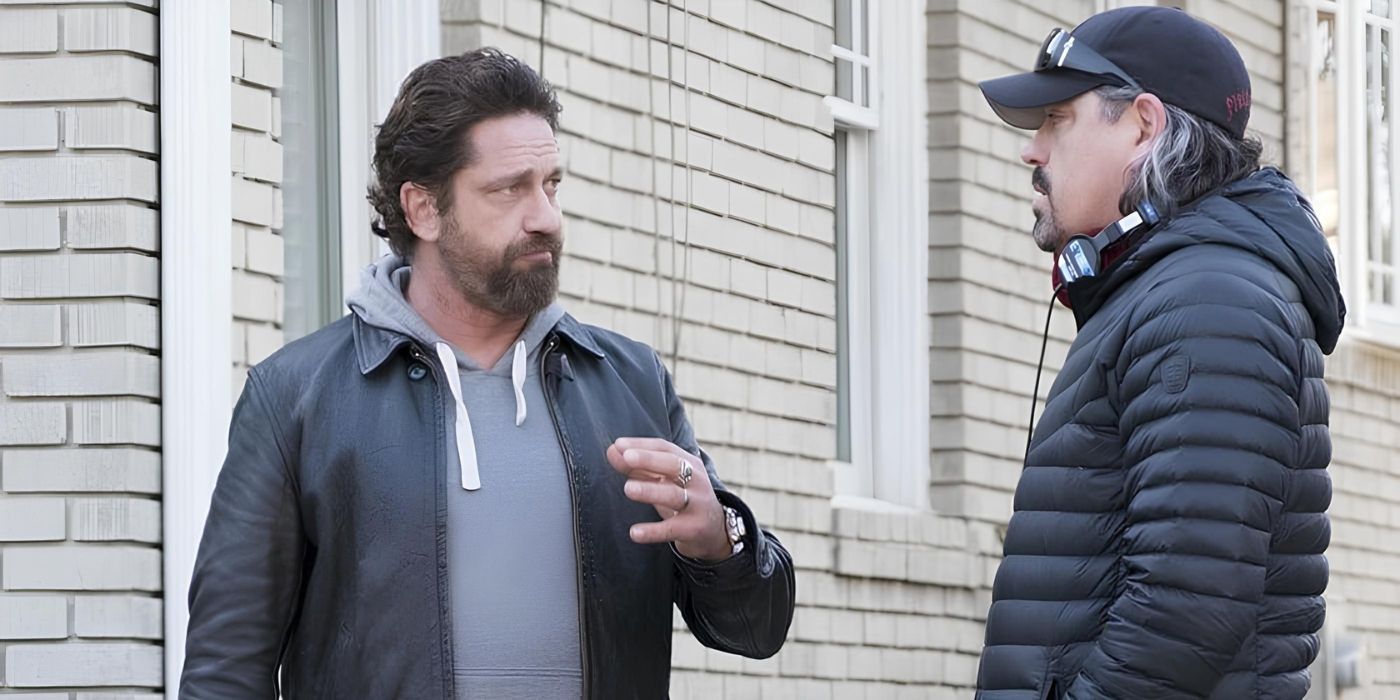 Gerard Butler talking to Christian Gudegast on the set of Den of Thieves