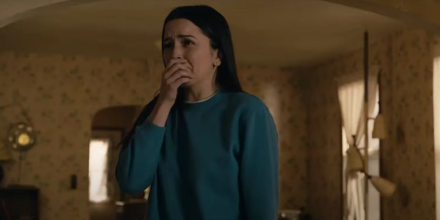 Hannah Cheramy, covering her mouth, in From Season 3