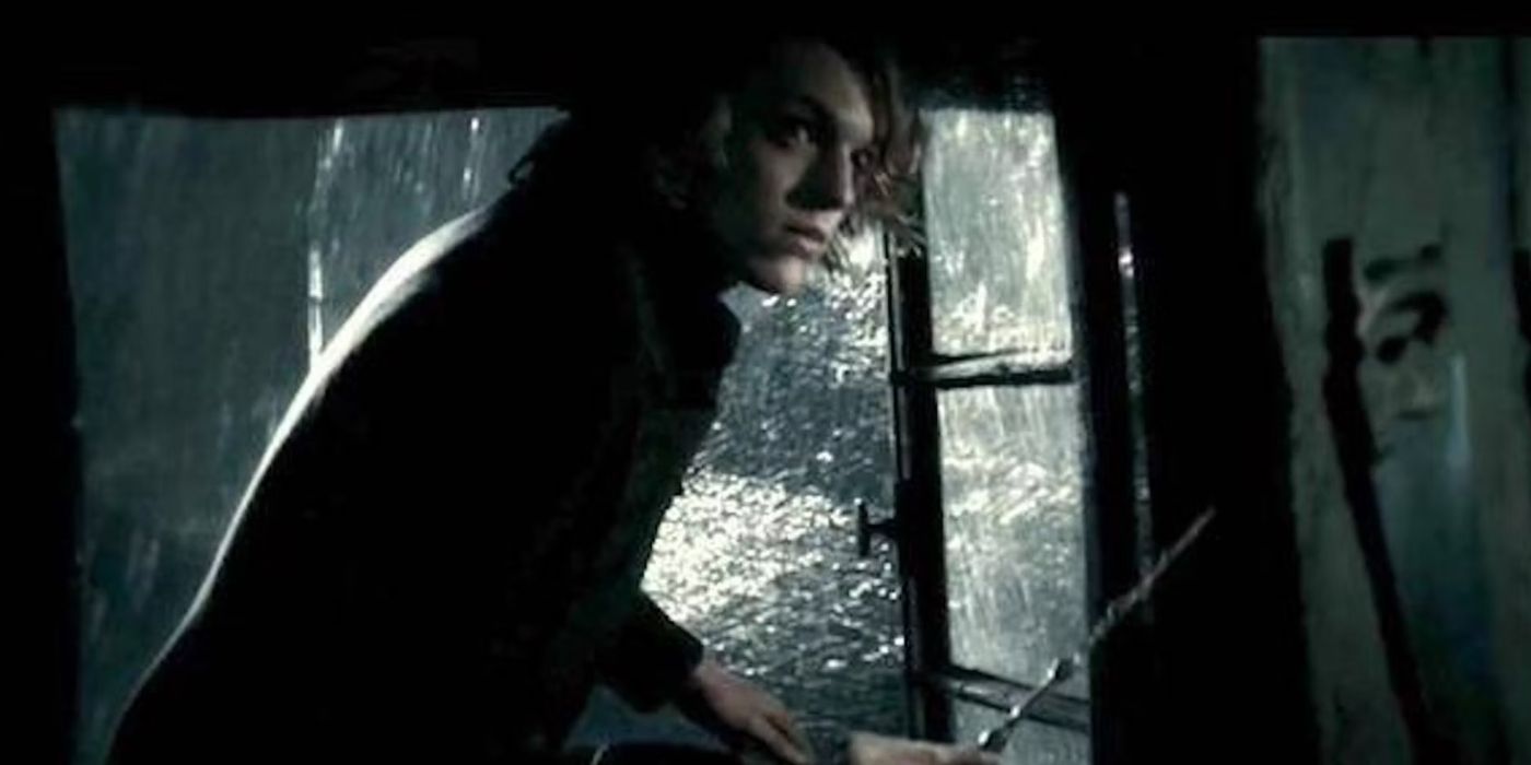 A young Gellert Grindelwald (Jamie Campbell Bower) dashes out a window and into a rainy night while holding a wand in &lsquo;Harry Potter and the Deathly Hallows: Part 1&rsquo; (2010).