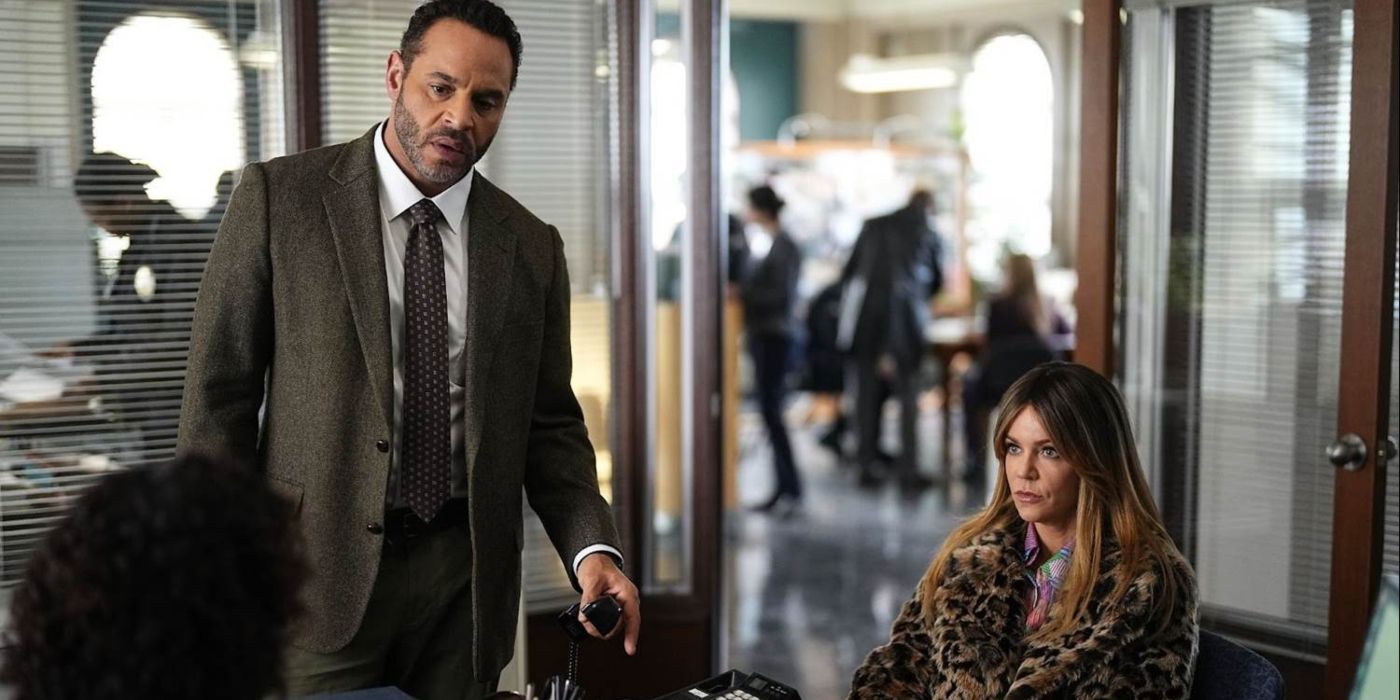Karadec (Daniel Sunjata) stands next to a seated Morgan (Kaitlin Olson) in &lsquo;High Potential.'