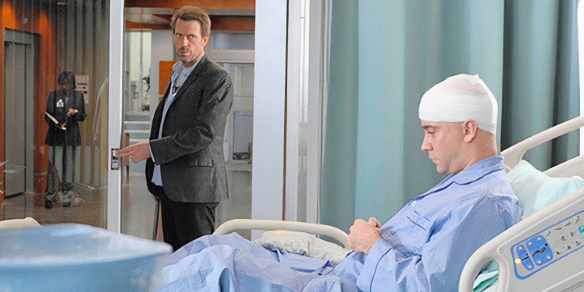 Hugh Laurie standing in the doorway of a hospital room looking at Dave Matthew sitting up in a hospital bed in House