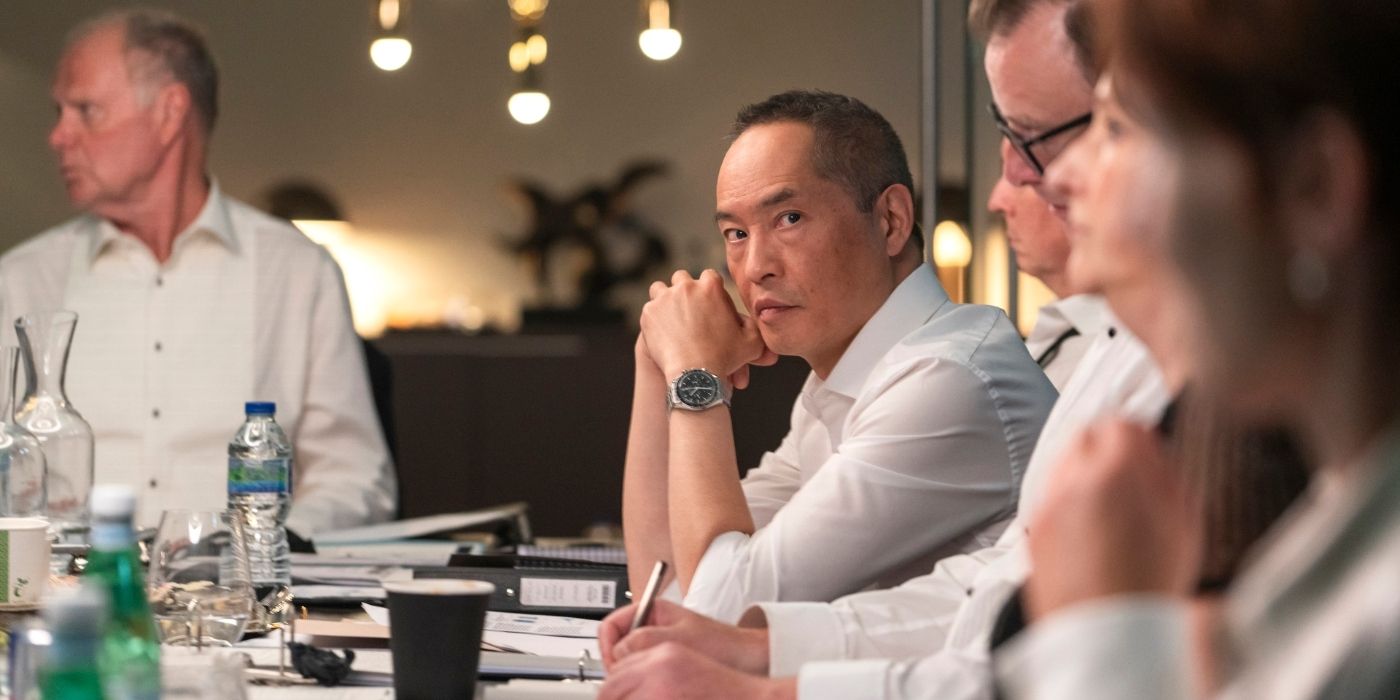 Ken Leung looking down a table in Industry Season 3 Episode 7