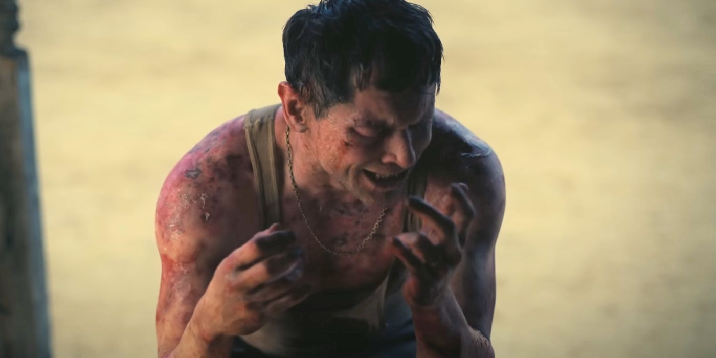 Jack O&rsquo;Connell wearing a wife beater, burning in the sunlight, in Sinners.