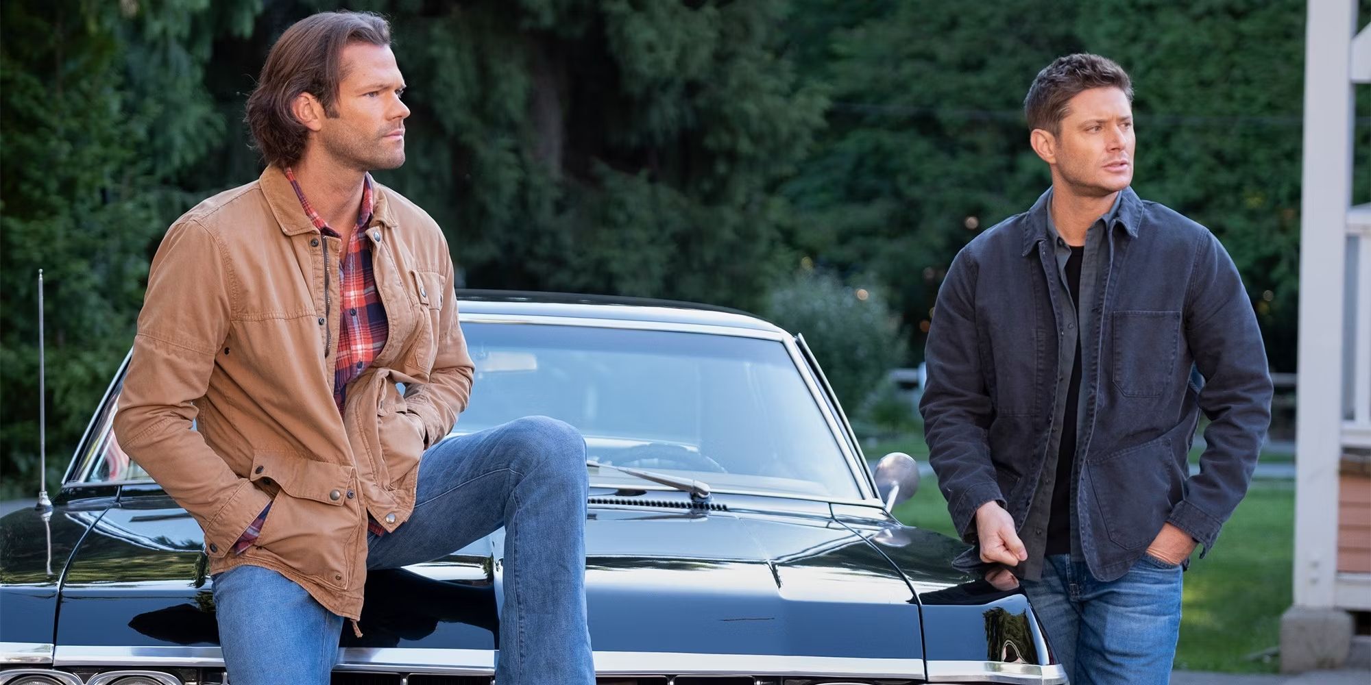 Sam (Jared Padalecki) and Dean (Jensen Ackles) Winchester waiting by a car in Supernatural