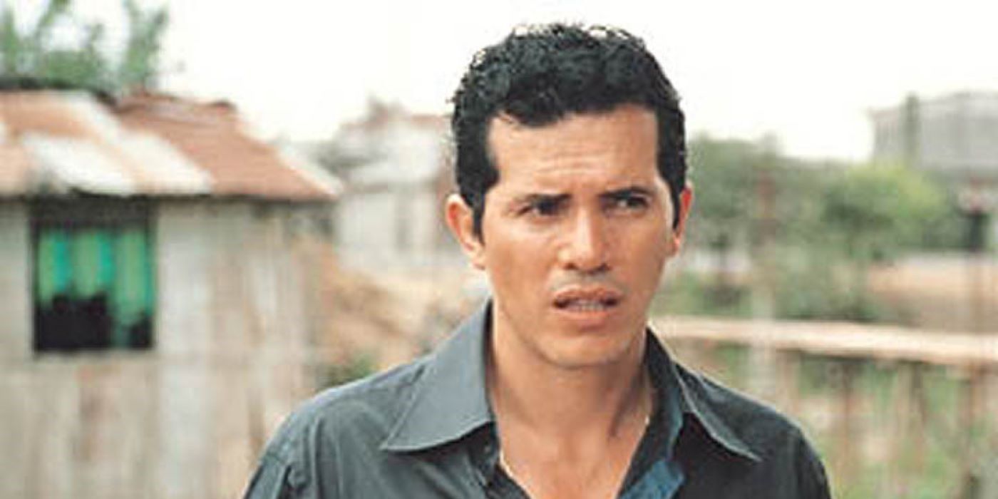 John Leguizamo as Manolo Bonilla walks outside cautiously in Cronicas