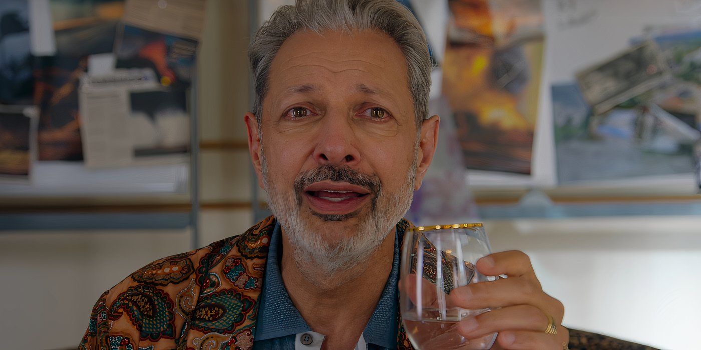 Zeus (Jeff Goldblum) joyfully watches his plan unfold with a glass of wine in 'KAOS'.