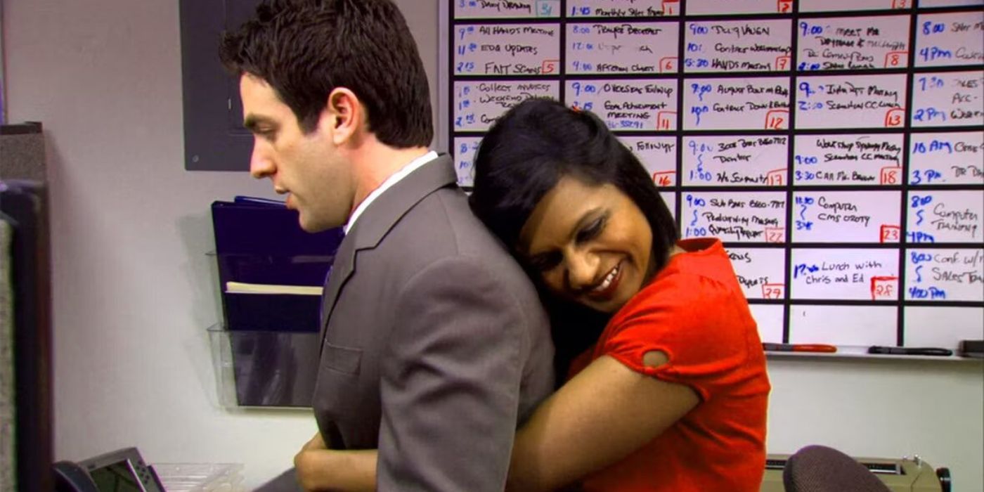 Kelly hugs Ryan from behind in the copy room on The Office