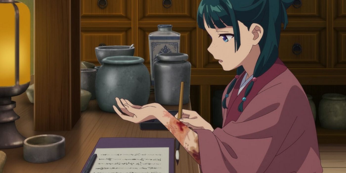 Maomao testing poison on her arm and taking notes in The Apothecary Diaries