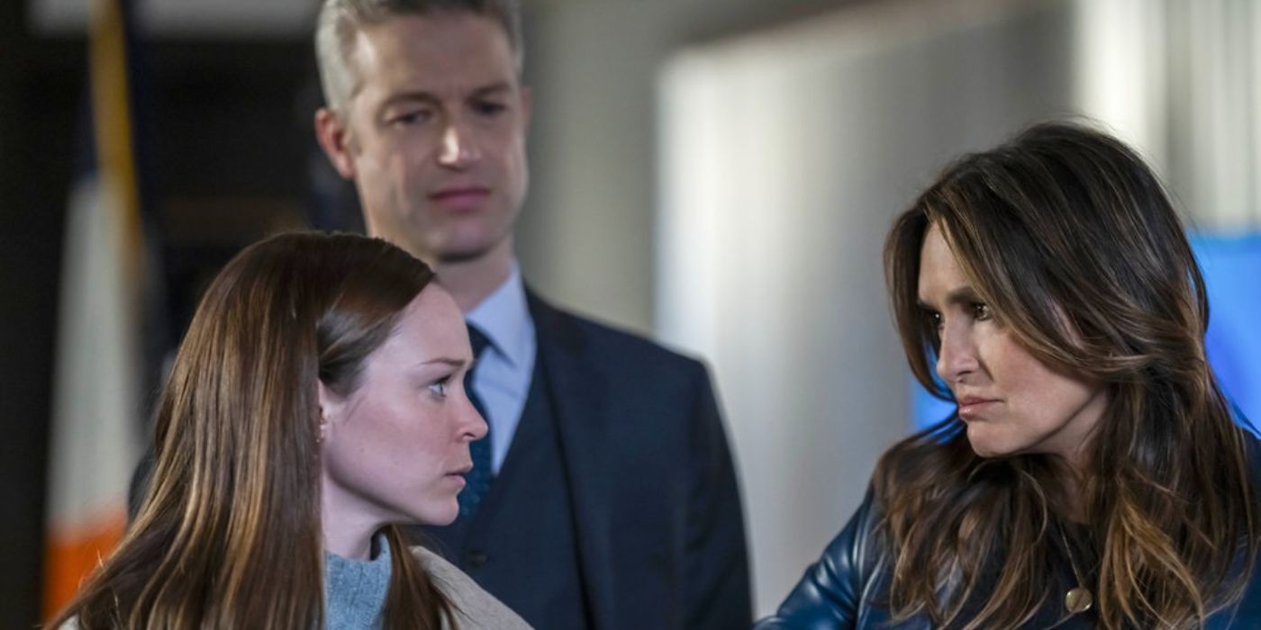Caitlin Houlahan as Anne looks at Captain Benson with ADA Carisi in the background in Law &amp; Order: SVU.