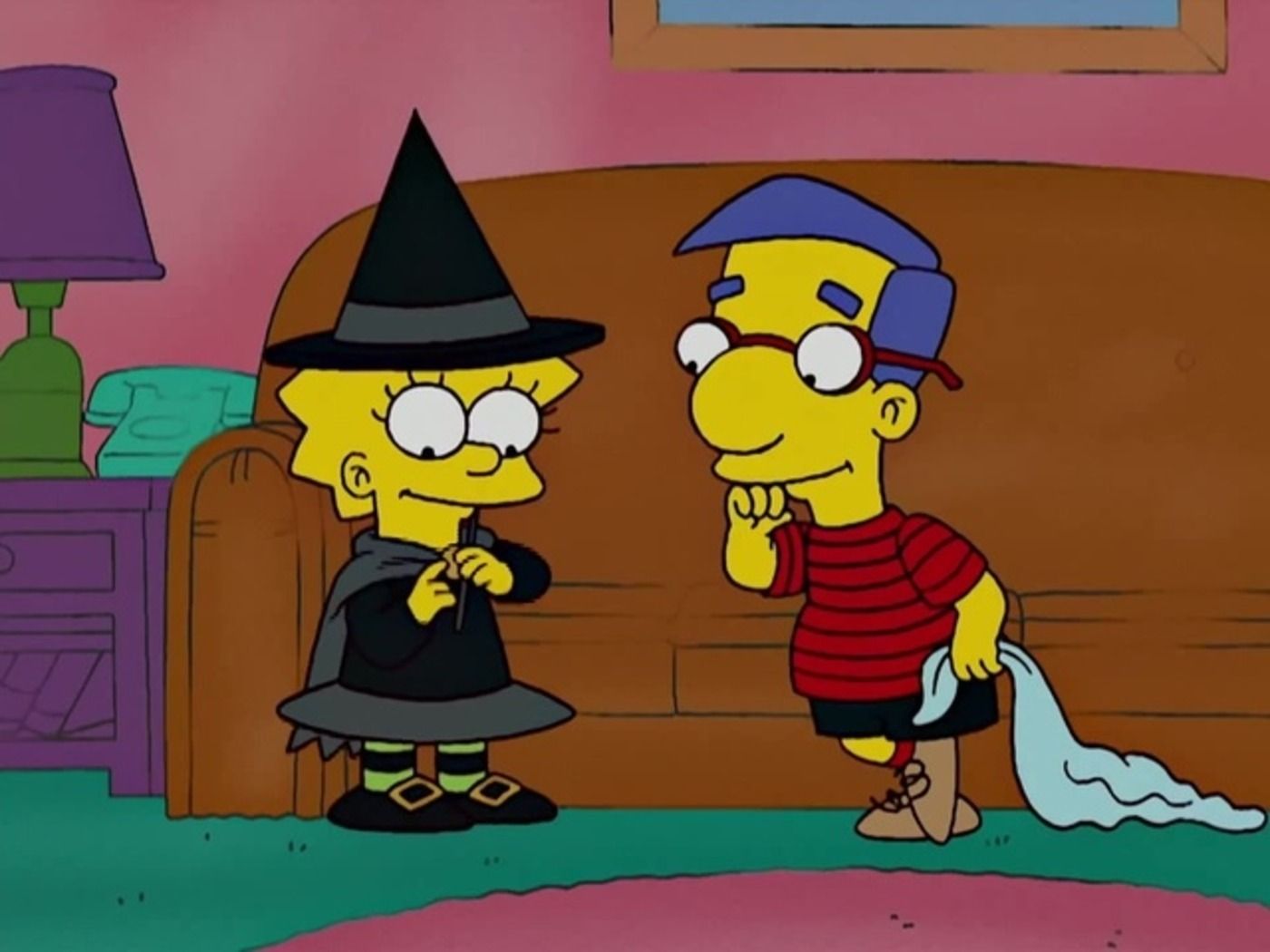Lisa Simpson talking to Millhouse on The Simpsons.