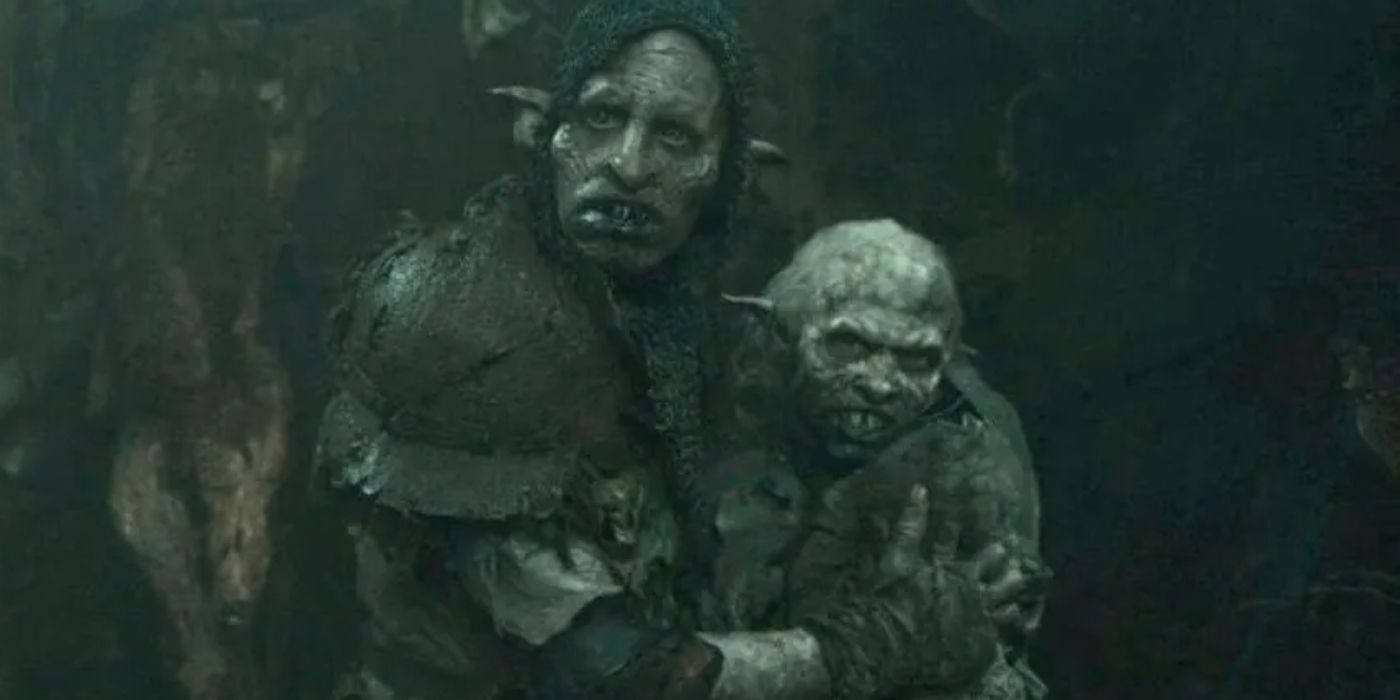 The Orc Glüg comforts his family in The Rings of Power Season 2