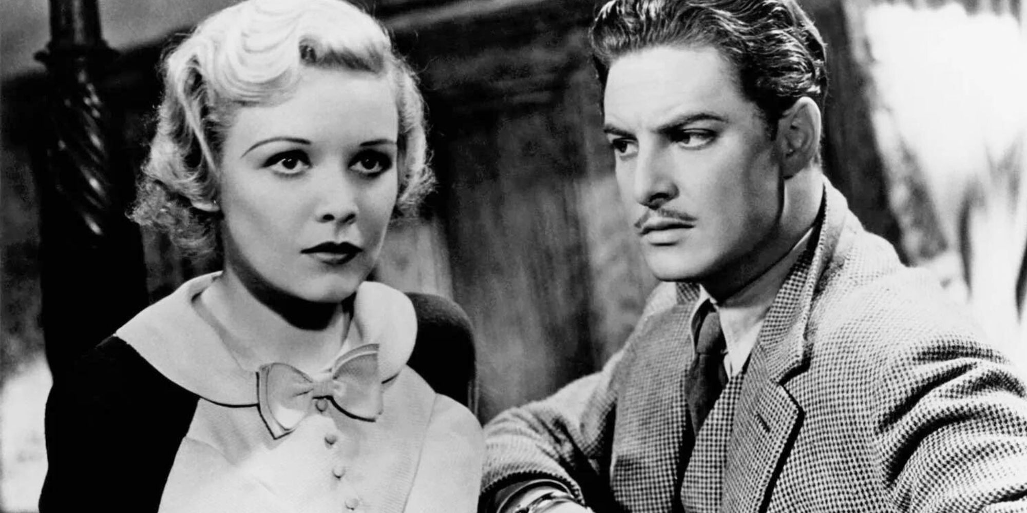 Madeleine Carroll sitting next to Robert Donat in 'The 39 Steps' (1935)