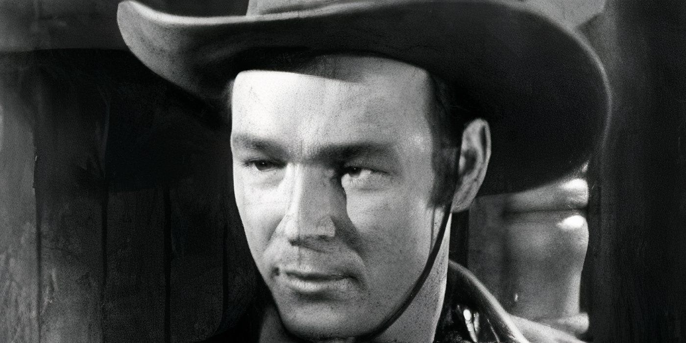 A closeup of Roy Rogers in a cowboy hat looking off camera in 'Man From Cheyenne' (1942).