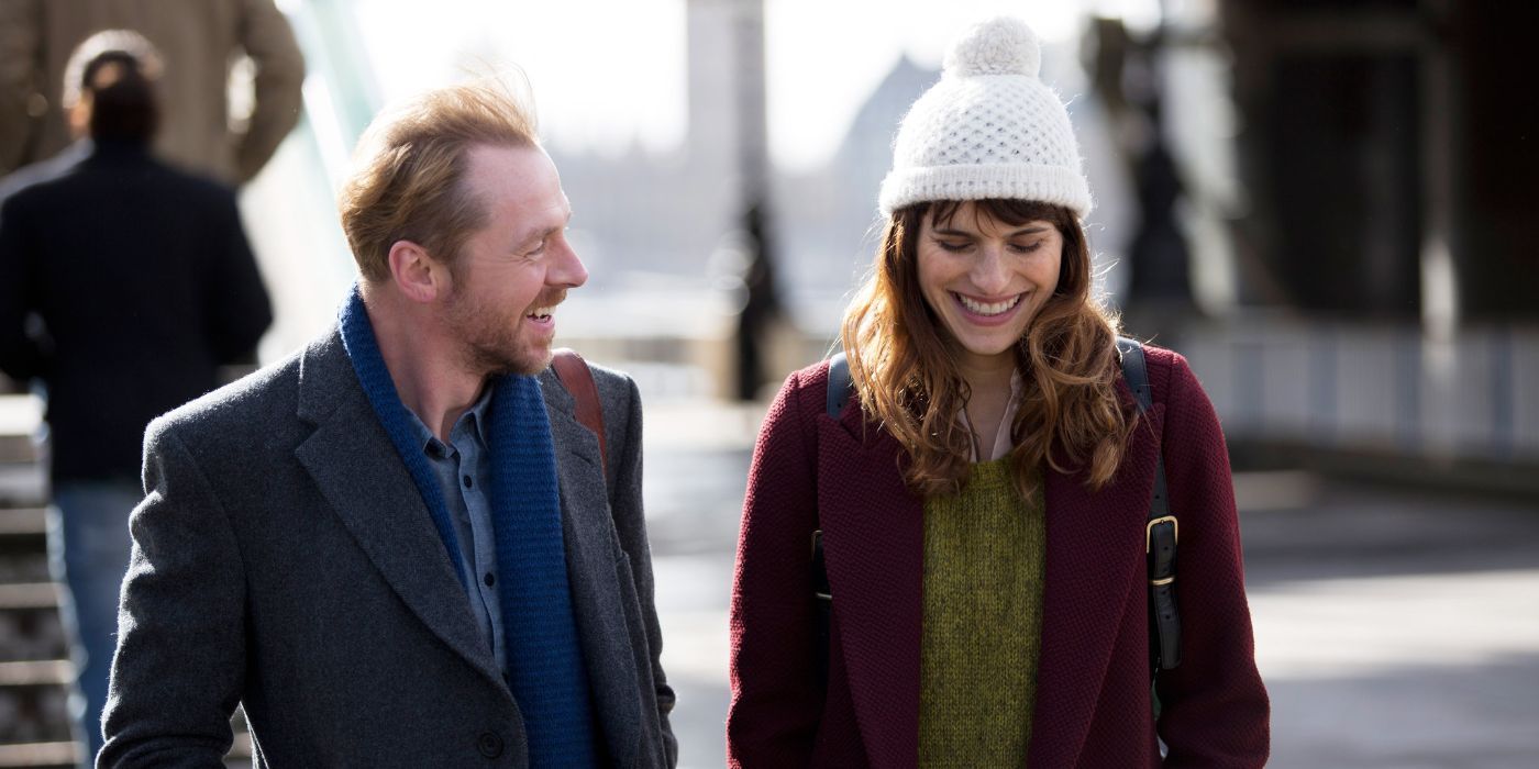Jack (Simon Pegg) and Nancy (Lake Bell) walk side by side as they both chuckle at each other in Man Up.