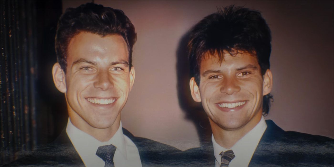 A picture of Lyle and Erick Menendez wearing suits and smiling in Netflix's The Menendez Brothers 