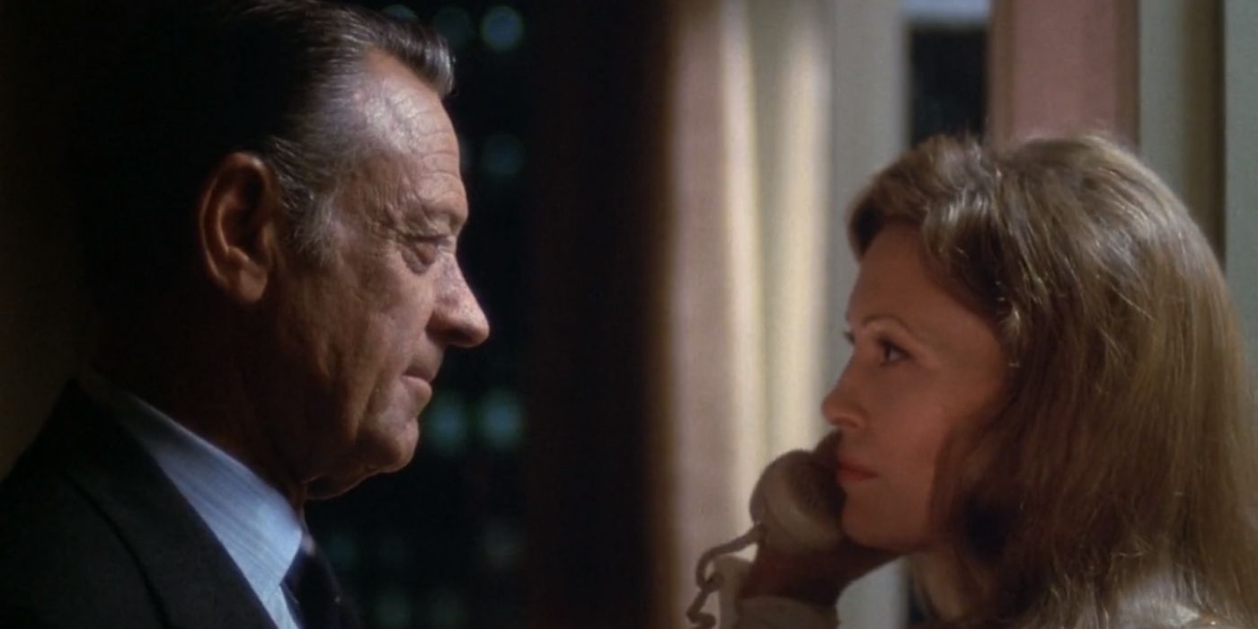 Max Schumacher (William Holden) looks into Diana Christensen&rsquo;s (Faye Dunaway) eyes as she speaks on the phone in &lsquo;Network&rsquo; (1976).