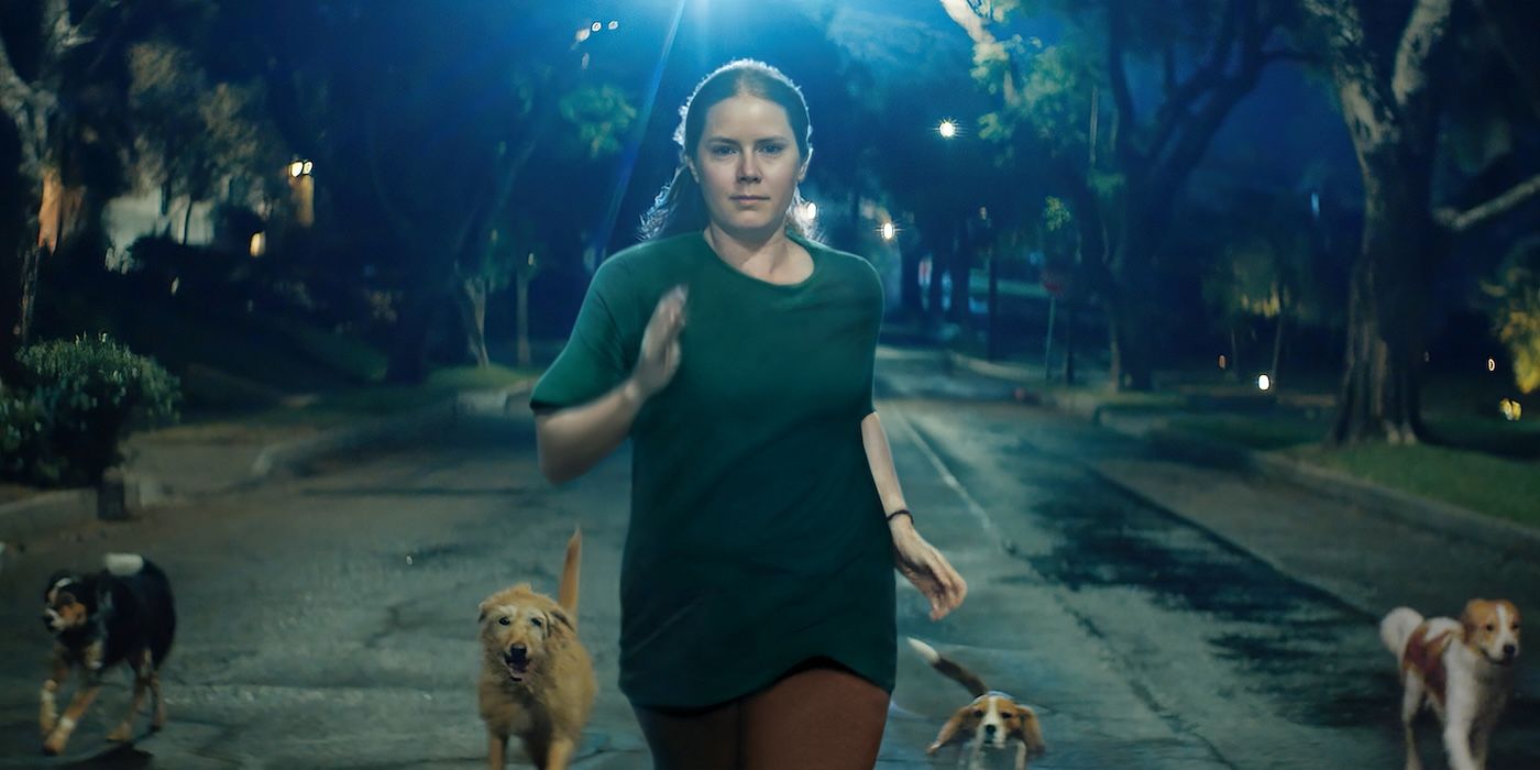 Amy Adams running with a pack of dogs in Nightbitch