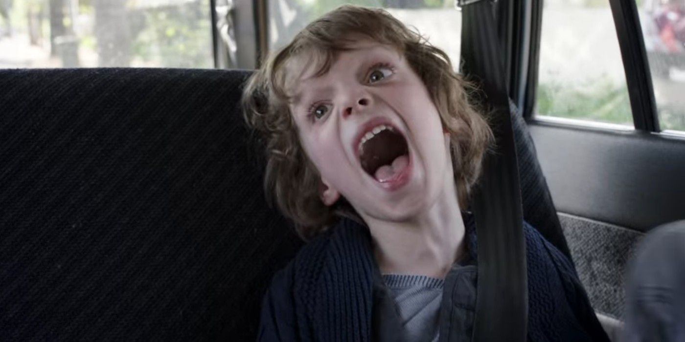 Noah Wiseman screaming in the back of a car in The Babadook