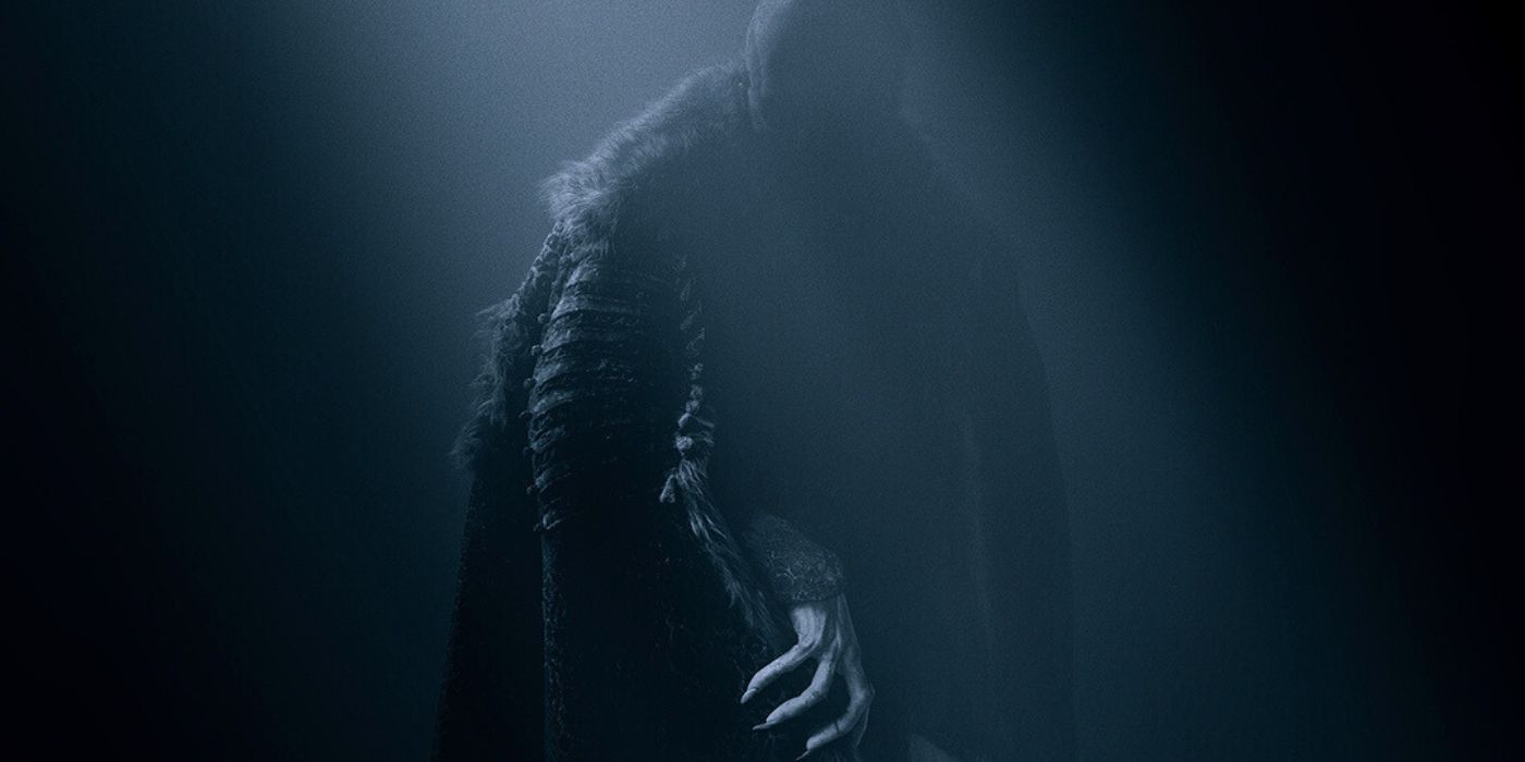 Bill Skarsgård creeping in the shadows, showing his clawed hand as Count Orlok on the poster for Nosferatu.